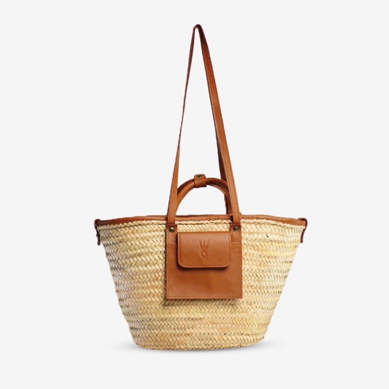 Raffia and leather basket designed for La Sultana Raffia and leather basket designed for La Sultana
